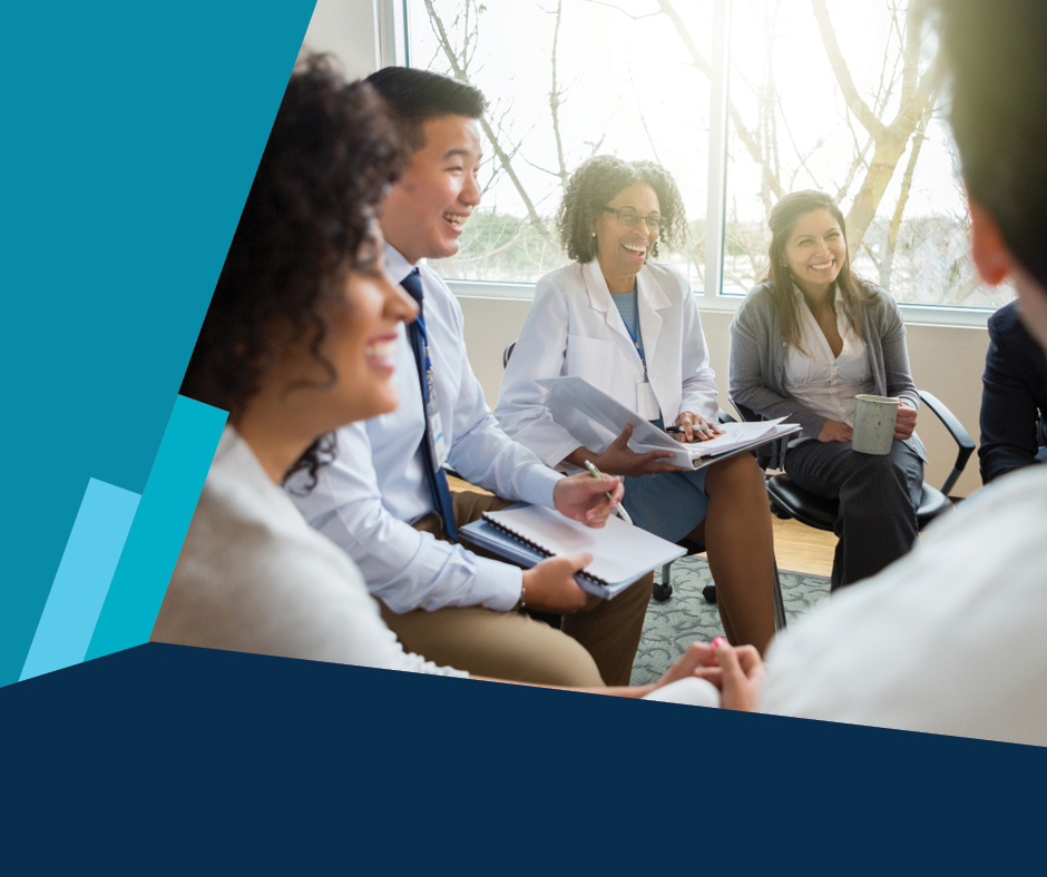 Physicians sitting in a group with notepads